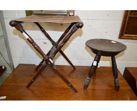 A mahogany folding stool together with a carved stool "Sit Ye Doun".