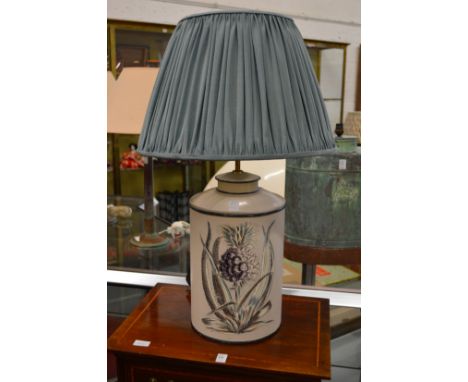 A good decorative table lamp modelled as painted tea canister.