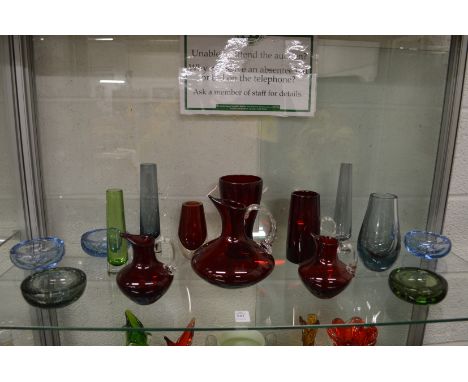 A small collection of stylish glassware to include ruby tinted glass jugs, vases and small bubble glass dishes.