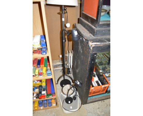 A Serious floor standing lamp, a matching table lamp, another standard lamp and a set of bathroom scales.