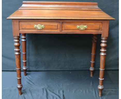 A Victorian mahogany desk, turned supports, c.1860