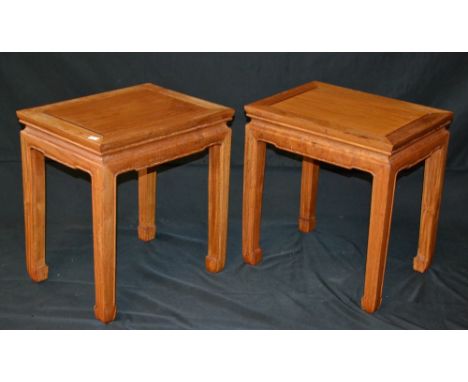 A pair of Chinese hardwood lamp tables