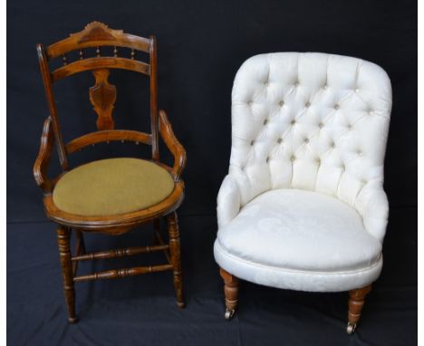 A Victorian low tub chair, button back, brass casters, c.1860; an Edwardian side chair, c.1910 (2)