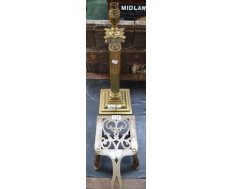 A 19th century brass Corinthian column table lamp, 52cm high; a cast iron and brass kettle stand (2)