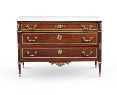 A LOUIS XVI MAHOGANY AND ORMOLU MOUNTED COMMODE CIRCA 1780 With Carrara marble top  89cm high, 127.5cm wide, 58cm deep