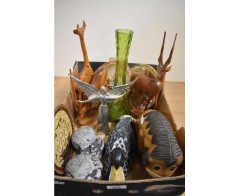 A vintage green glass vase, two hand carved African deer and a similar Giraffe, a wooden Eeyore style donkey, wooden duck stu