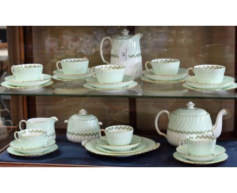 A Minton Cheviot pattern tea set, for eight, comprising cups and saucers, side plates, bread and butter plate, tea pot, milk 