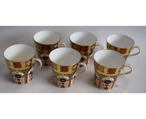 A set of six Royal Crown Derby 1128 Old Imari pattern breakfast beakers, solid gold band, printed marks, first quality (6)