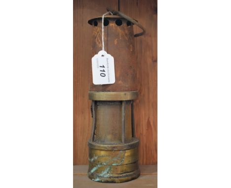 A brass and steel miner's lamp, 24cm high