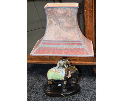 A Japanese Satsuma table lamp, as a small elephant atop a large elephant, 33.5cm high over fitting