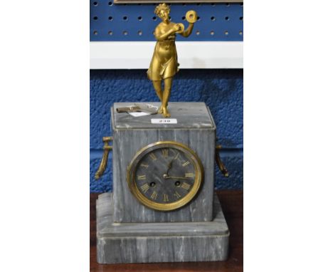 A French gilt brass and polished grey marble figural mantel clock, surmounted with a classical beauty, two gilt brass carry h