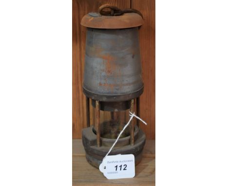 A miner's safety lamp, The Wolf Safety Lamp Co, Wolf type FS, the top with impressed plate, PO 1973, 21cm high