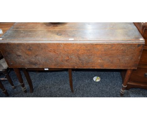 A 19th century oak centre/dining table, rectangular top with single fall leaf, turned legs, arrow feet, 120.5cm long, opening