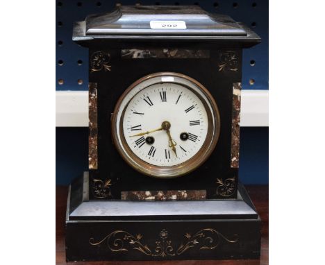 A French slate mantel clock, engraved with scrolling leaves, picked out in gilt, inlaid with marble lozenges