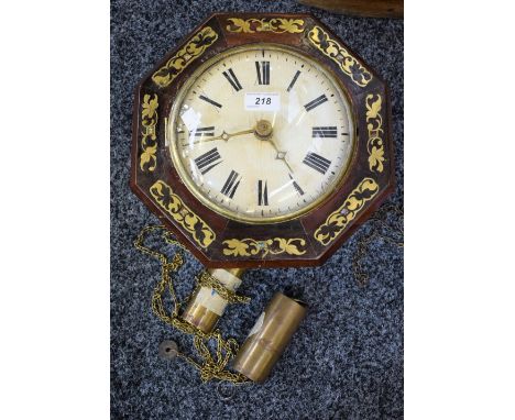 A rosewood octagonal brass and abalone shell inlaid wall clock, white painted dial, Roman numerals, the interior of the case 
