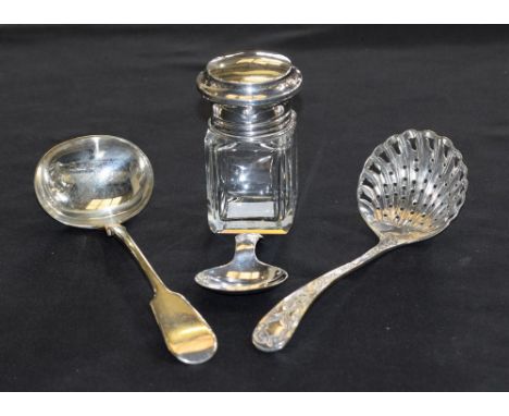 A clear glass silver mounted smelling salts bottle, Birmingham 1875; a silver caddy spoon, Sheffield 1905; a silver plated su