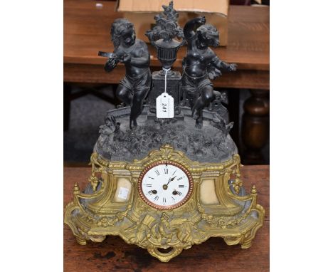 A late 19th century French mantel clock, surmounted by dancing children, gilt metal base, approx 47.5cm high 