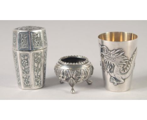 THREE ORIENTAL SILVER ITEMS; a dragon goblet, a octagonal container and a miniature tripod bowl, combined weight 130g, (3).