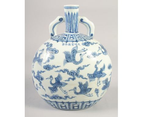 A CHINESE BLUE AND WHITE PORCELAIN TWIN HANDLE MOON FLASK, painted with cranes and clouds, bearing six-character mark, 28cm h