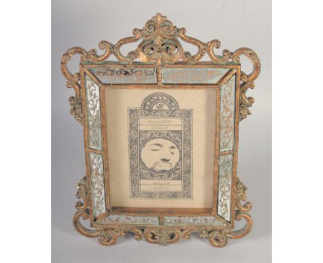 A LATE 20TH CENTURY IRAN CALLIGRAPHIC LITHOGRAPH OF A YOUNG POET OR MARTYR, with central roundel containing the image of a yo