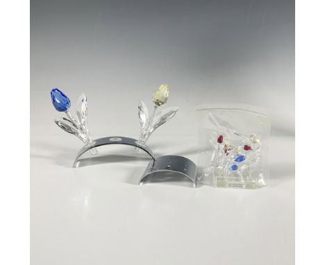 This vibrant crystal collection features a yellow and blue tulip on a stand, along with a second stand holding nine miniature