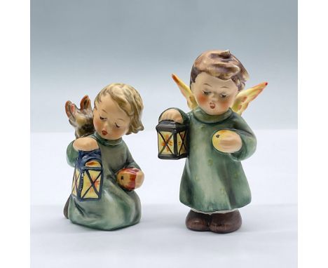 Features a pair of adorable angels holding apples and lanterns. Largest measures 2"L x 1.5"W x 3.5"H. Goebel Hummel backstamp