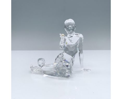 Enchanting clear crystal figure holding a light cream rose pearl. Swarovski backstamp. 827603. This item has its original box
