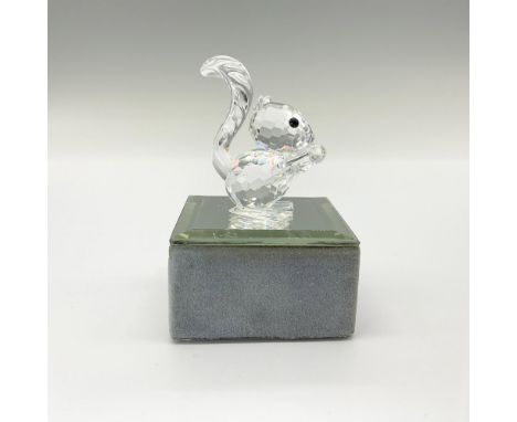Clear faceted body with fluffy molded tail. This item has its original box. Dimensions of box: 2.75"H x 3.25"D. Swarovski bac