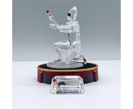 Third piece in the Masquerade Trilogy. Created with clear and frosted crystal. Showcases Harlequin kneeling, presenting a red