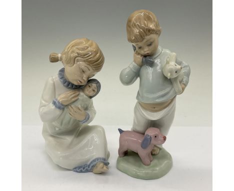 The larger figurine, Girl Holding Doll, measures 4.25"L x 3"W x 6"H, while the smaller figurine, Boy on Phone, measures 3"L x