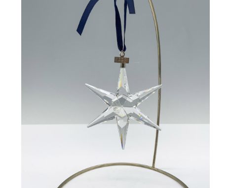 Limited edition crystal ornament with a metal tag reading 1993 as well as 6 points with flat ends that all together form an e