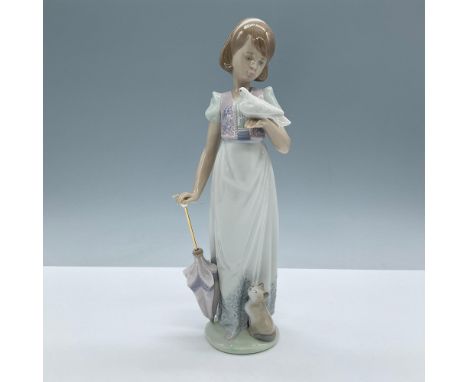 Glossy porcelain. Depicts a young girl holding a dove and an umbrella with her cat by her side. Lladro backstamp. This item h