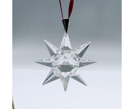 The first in the yearly series of stars and snowflakes, this brilliant clear crystal star ornament features 8 points with 199