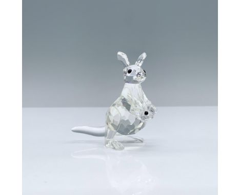 Faceted crystal figurine modeled as a mother kangaroo with her adorable baby popping its head out of her pouch. Swarovski aci