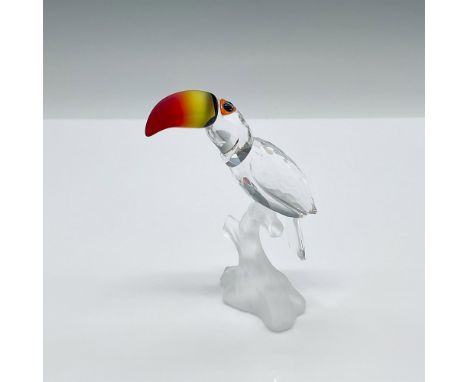 Part o the Feathered Beauties collection. A clear crystal tropical bird perched on a frosted branch. The beak is made from fi