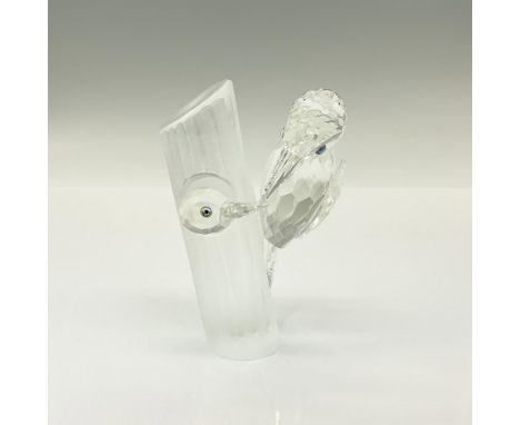 Brilliant clear crystal SCS Annual Edition figure of a young wood pecker peeking out of a nest in a frosted tree and met by a