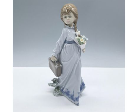 Sweet glossy finished figural of a young girl carrying a bouquet of flowers and a valise on her way to school. Lladro Collect