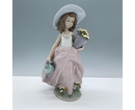 Glossy porcelain. Features a lovely girl carrying colorful flowers. Lladro backstamp. This item has its original box, dimensi
