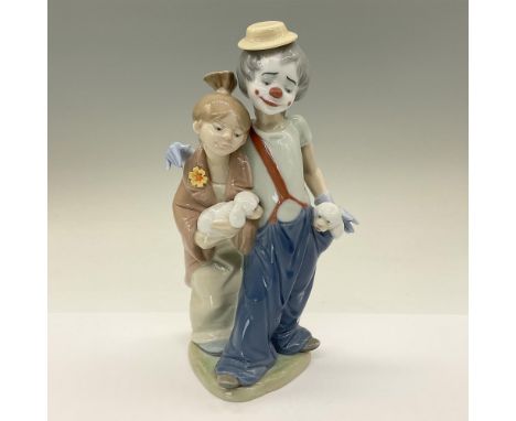 A glossy figure of two friends. A clown with a dog in his pocket has his arm around a woman who is holding a dog. 2000 LCS Fi