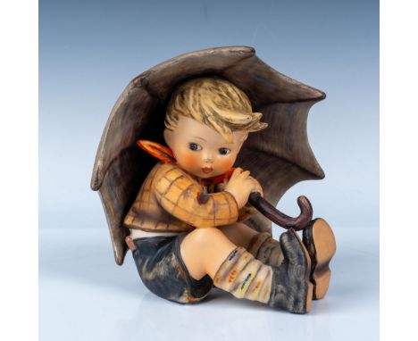 Umbrella Boy is a cherished piece from the Hummel collection, inspired by the artwork of Sister Maria Innocentia Hummel and p