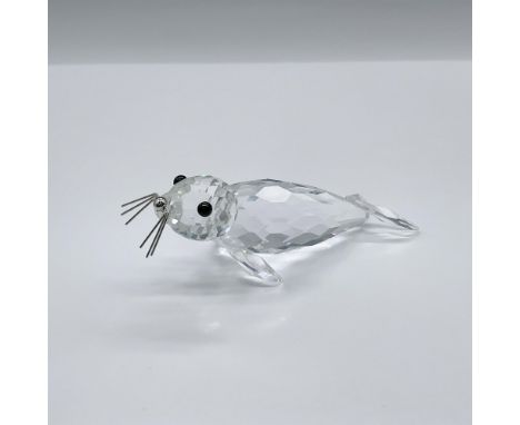 Part of the Kingdom Of Ice And Snow group. A clear crystal aquatic mammal with black eyes and silver nose and whiskers. Swaro
