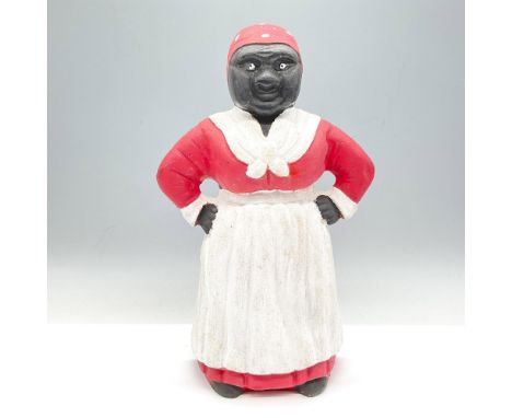 Early 20th century metal work wearing her apron and head scarf colored in red and white. Issued: 20th centuryDimensions: 6.5"