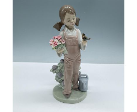 Glossy finish, features a girl enjoying gardening. Lladro backstamp. This item has its original box, dimensions: 10.5''L x 5.