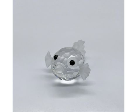 Part of the South Sea theme. A clear facetted crystal with frosted crystal fins, tail, and mouth. Eyes are made from black cr