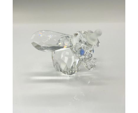 A clear crystal figure of Dumbo with his ears and trunk raised a bit. Blue crystals are used for the eyes. Swarovski backstam