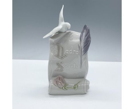 Features a dove and quill sitting on the top of a scroll marked Lladro Society. Glossy finish. Lladro Society backstamp. This