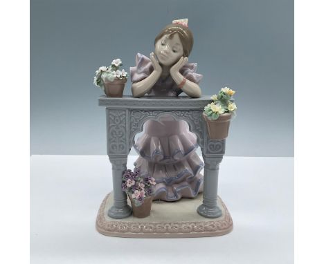 Beautiful glossy porcelain depiction of a flamenco girl dreaming on a balcony adorned with intricate flowers. Lladro back sta