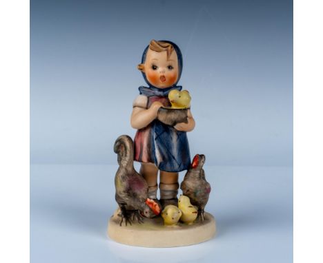 This is a Goebel Hummel figurine titled Feeding Time, mold number 199, and identified with the TMK-5 trademark (1972-1979). I