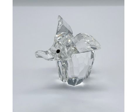 Part of the African Wildlife series. A clear crystal figure of an elephant with black eyes and frosted tail. Swarovski swan m