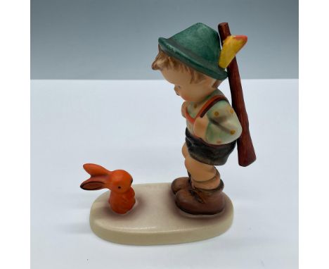 Beautifully hand painted porcelain of an adorable young boy carrying a rifle timidly hunting who comes face to face with a ra